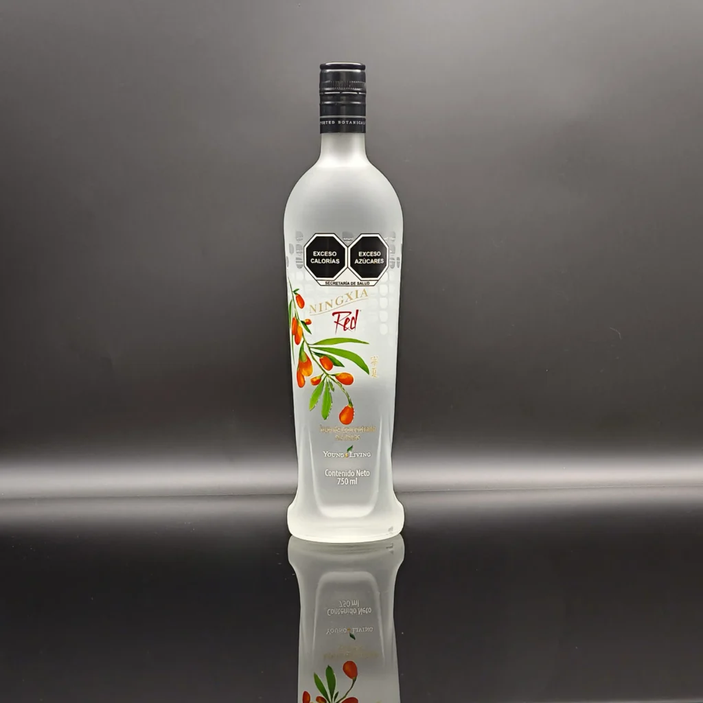 A premium 750ml slender custom glass bottle featuring a full-body frosted acid etching finish, decorated with vibrant multi-color wolfberry illustrations and black hex branding logos.