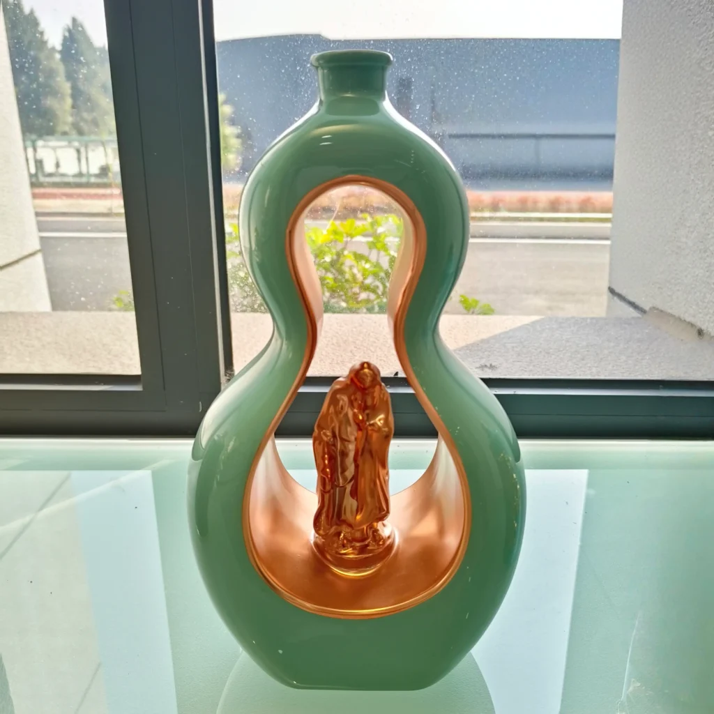 Dual-process electroplated and color-coated glass bottles for unique luxury packaging concepts