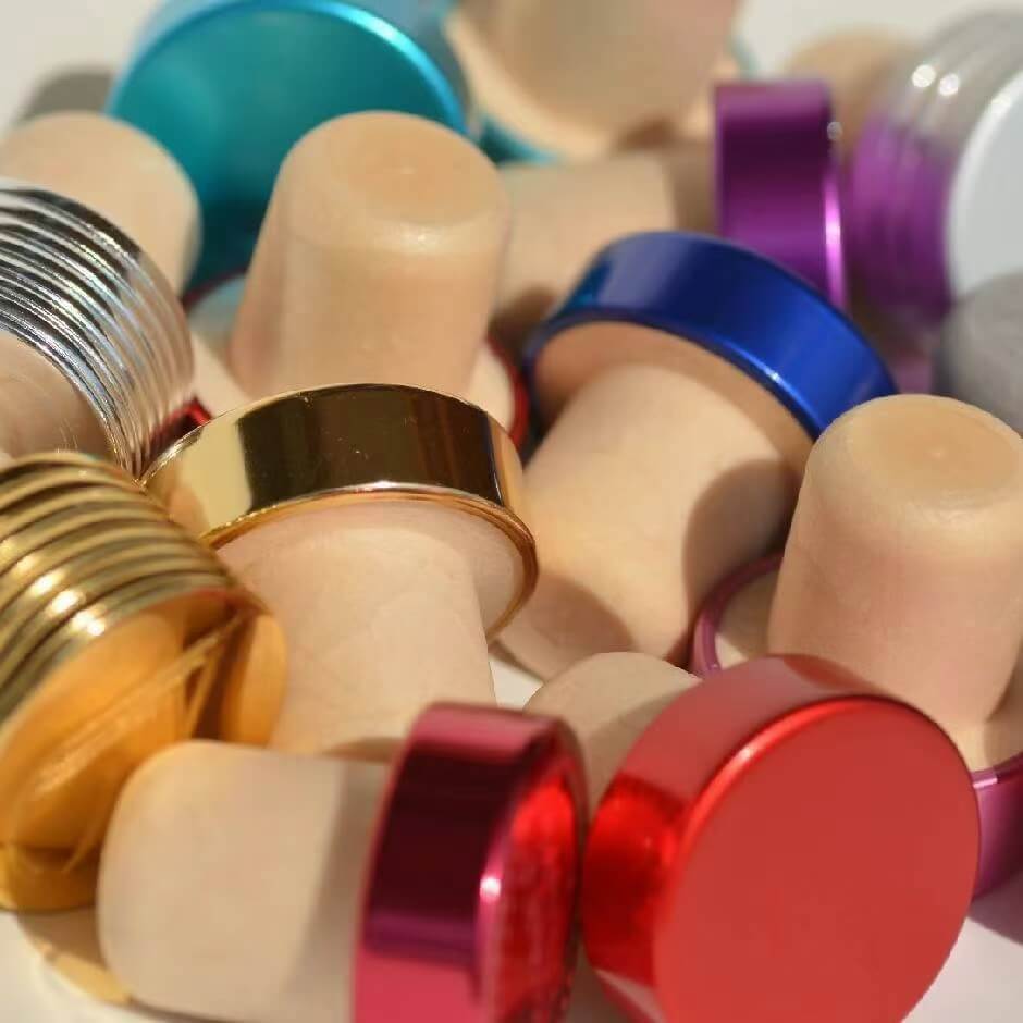 Custom T-top corks and metallic closures for premium spirits and whiskey bottle packaging solutions