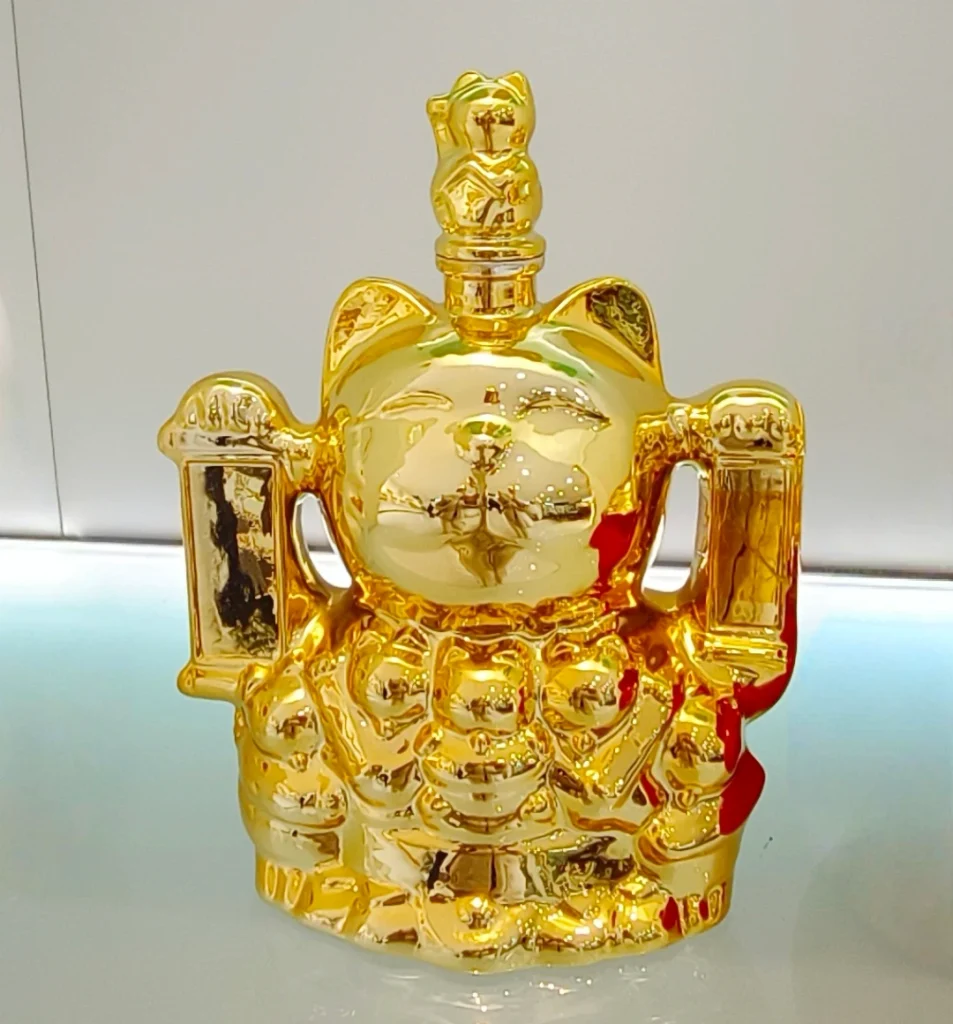 Full-surface gold electroplated glass bottles with high-impact mirror finish for spirits