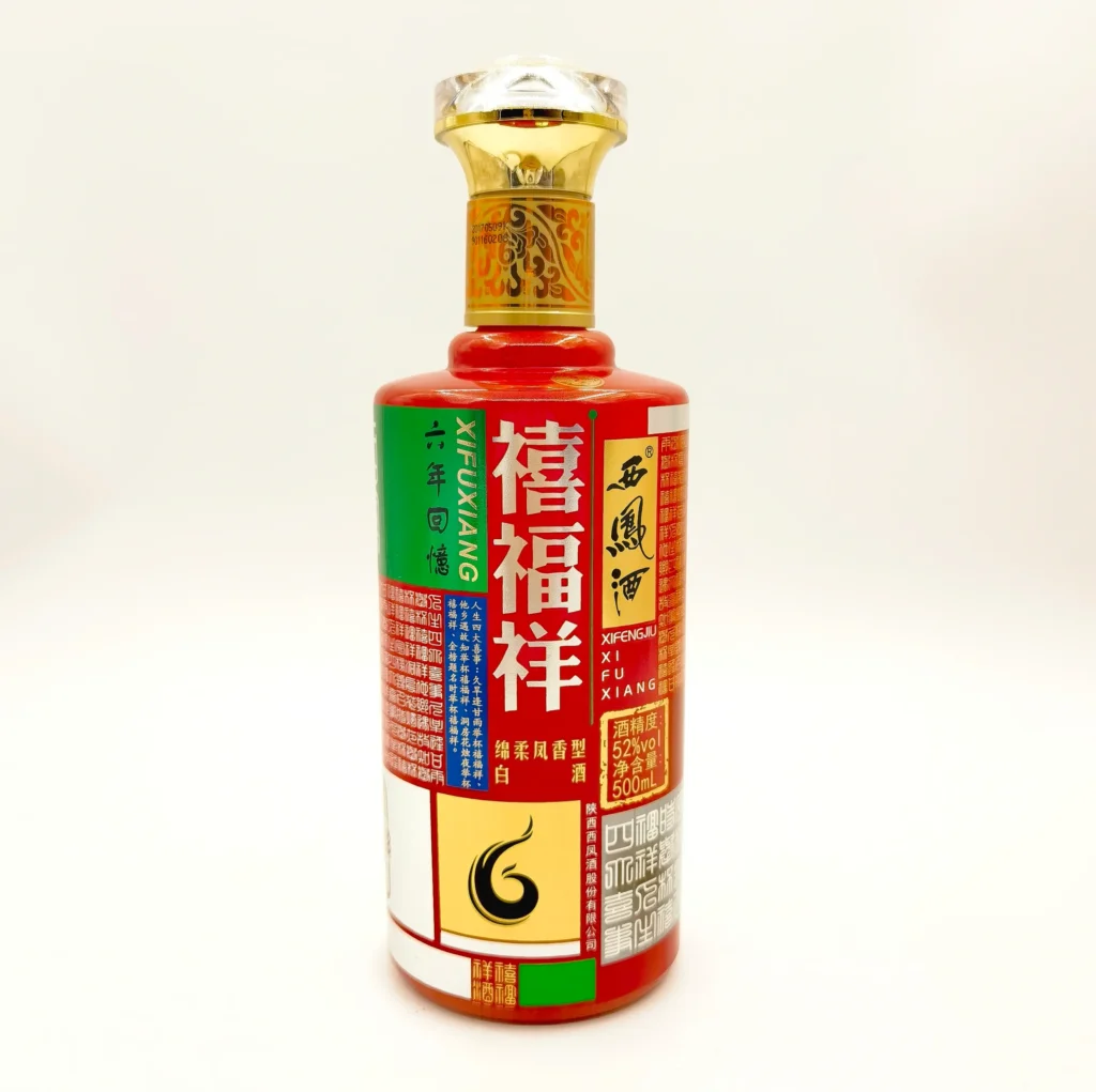 A custom spirits bottle showcasing high-coverage decoration with vibrant full-wrap multi-color graphics, dense typography, and seamless artwork application running entirely across the rounded bottle shoulder.