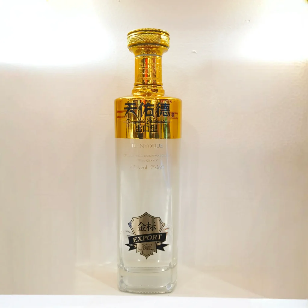 Custom electroplated glass bottles combined with detailed water slide decals for premium spirits branding