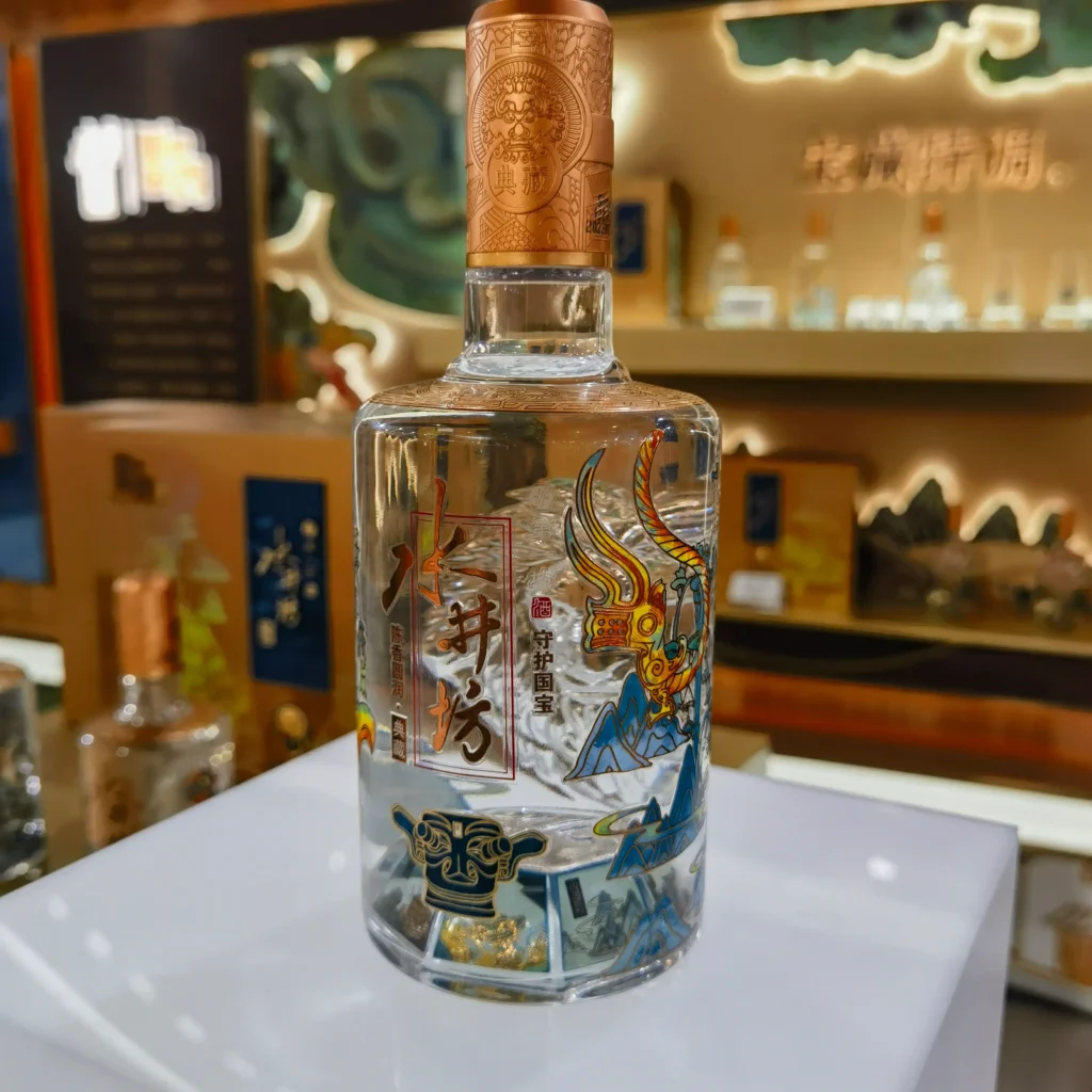Water slide decal decoration technique applied to premium spirits bottle for complex, high-definition branding