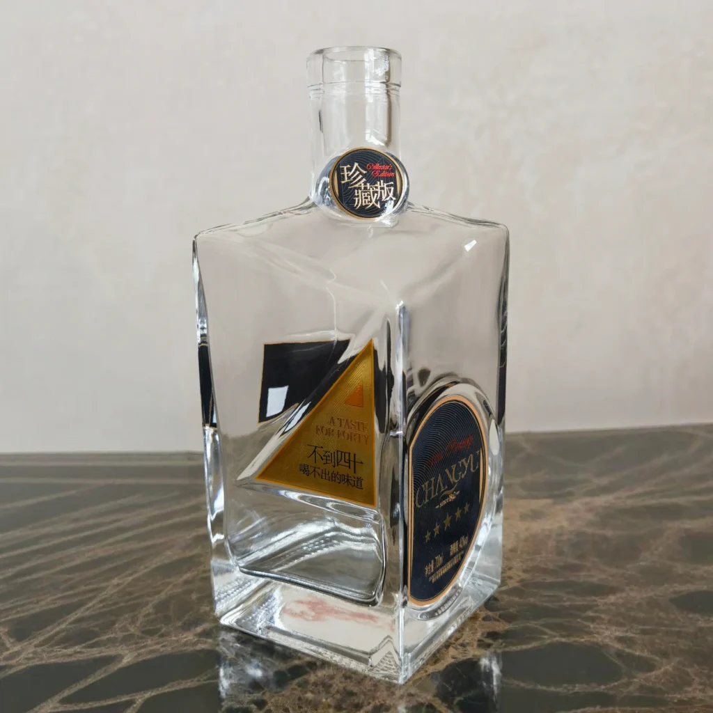 ater slide decal application on premium glass bottle with complex geometry and curved surfaces