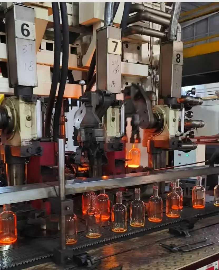 High-speed automated glass bottle production line demonstrating advanced manufacturing capability