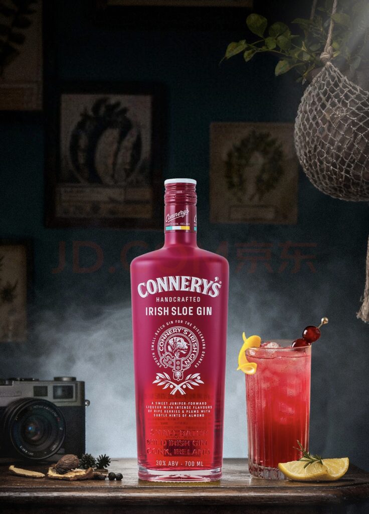 Screen printing on glass bottles applied over a vibrant color-coated finish for premium spirits packaging.
