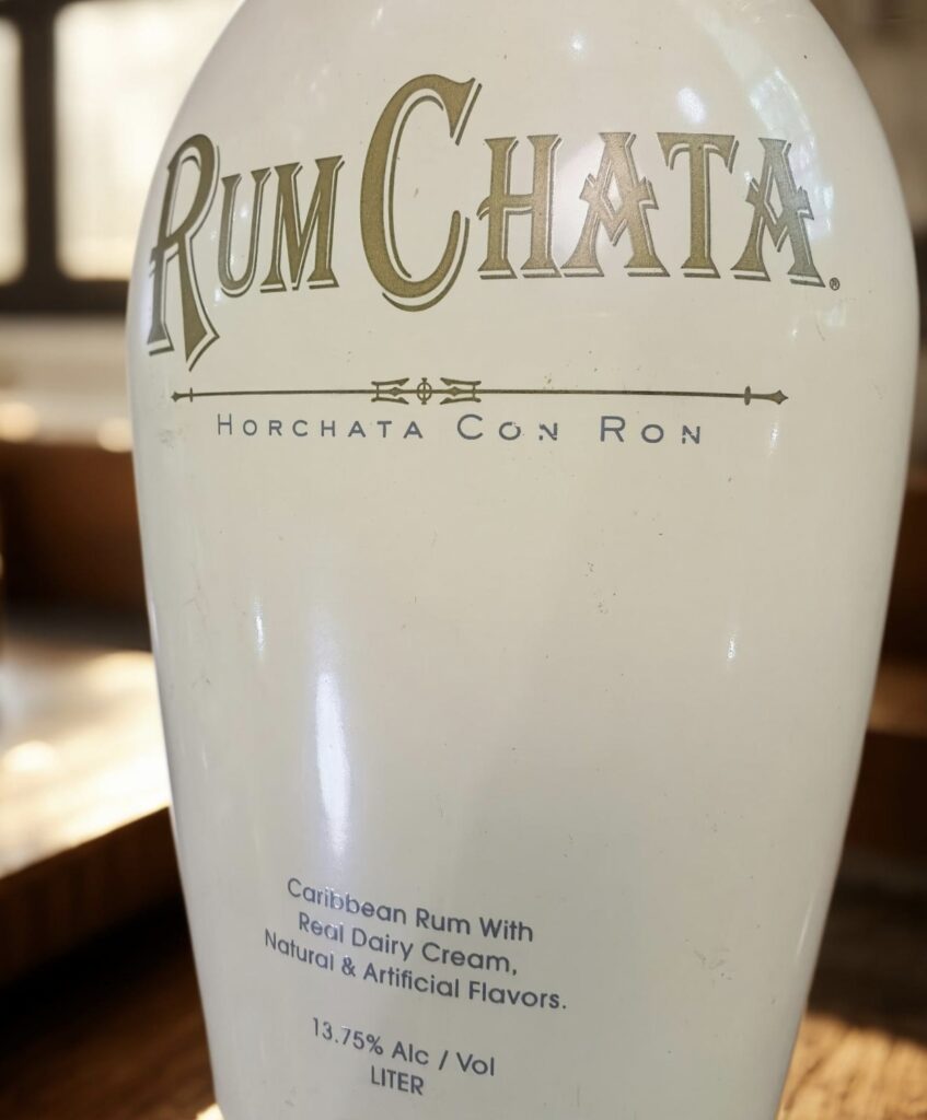 High-quality screen printing on glass bottles applied to a premium rum spirit bottle for precise branding.